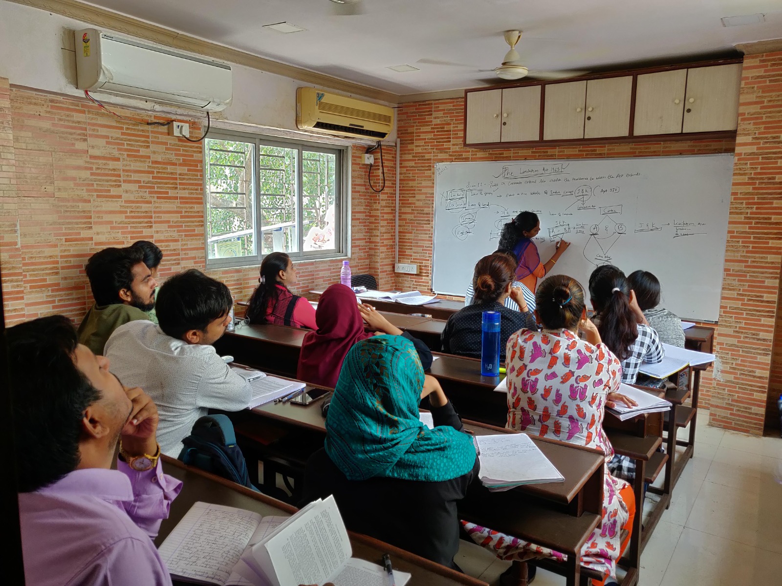 Faculty teaching at whiteboard